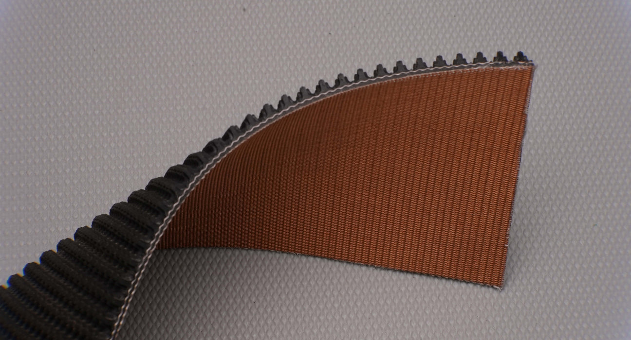 Side view of rubber conveyor belt showing thickness of 9/32 inch with black diamond top and brown bare bottom.







