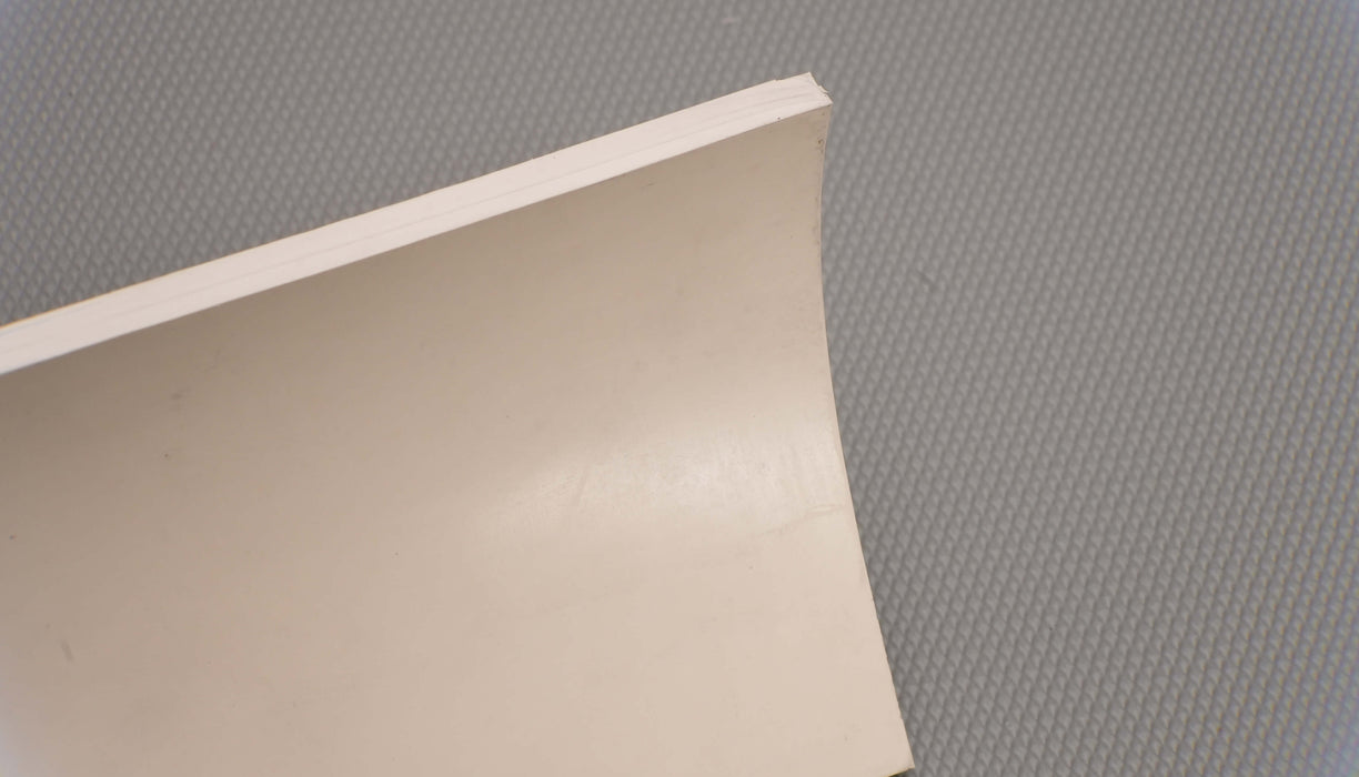 Second side view of rubber conveyor belt highlighting 1/4 inch thickness, smooth white surfaces, and tensile strength of 700 psi.