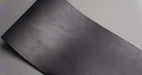 Thin profile of black rubber conveyor belt.