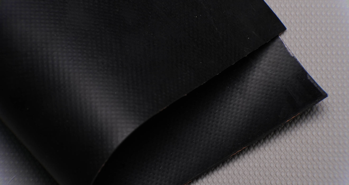 Top and bottom view of rubber conveyor belt with smooth black surfaces, 1/16 inch thickness, durometer 70, and tensile strength of 500 psi.

