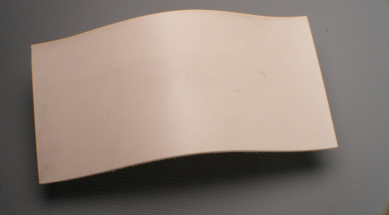 Top view of rubber conveyor belt with smooth white surface, 1/8 inch thickness, and a temperature range of -22°F to +176°F.







