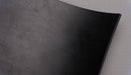 Black color on both top and bottom of rubber conveyor belt.