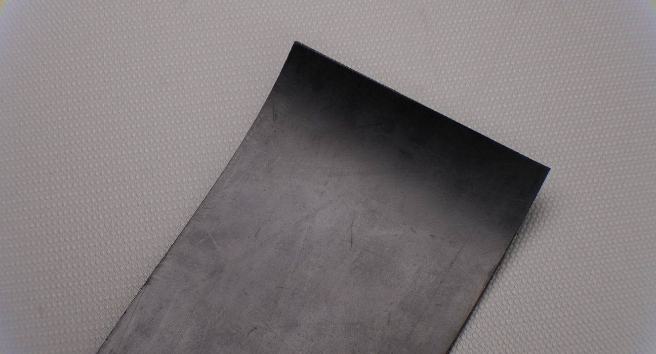 Uniform black finish on 1/8 inch rubber conveyor belt.