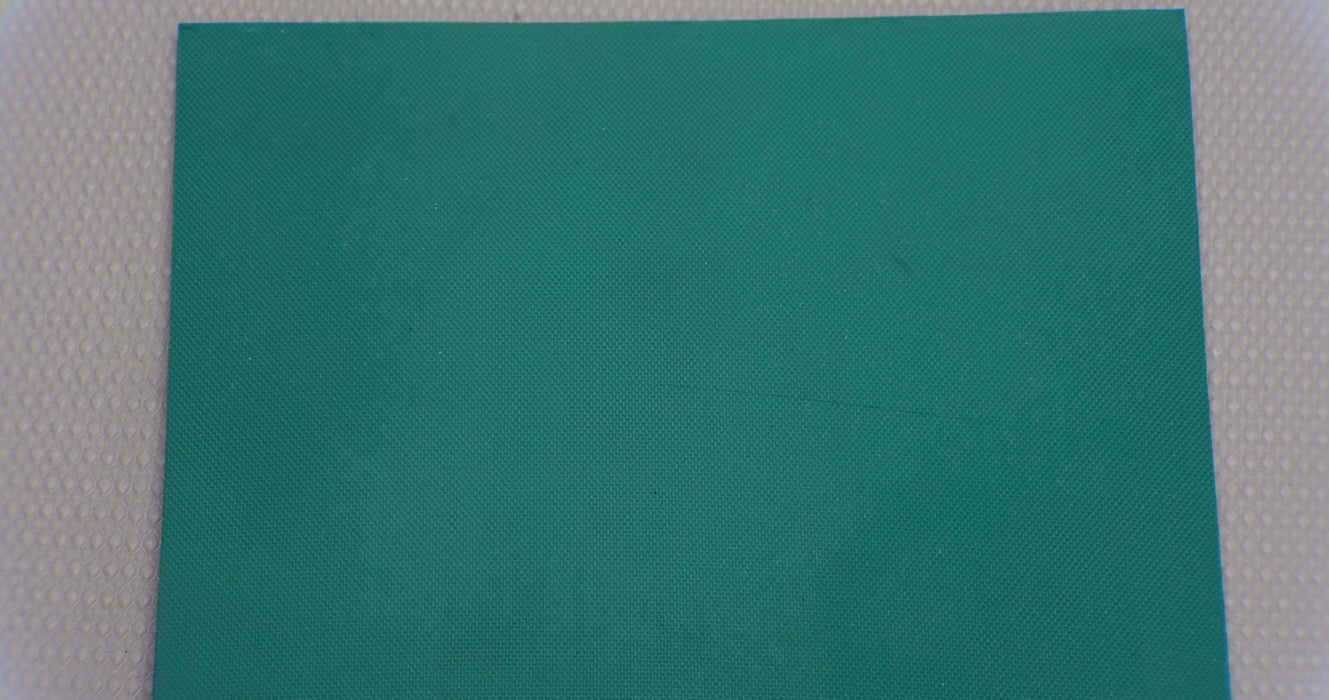 Close-up view of diamond surfacing on synthetic elastomer conveyor belt