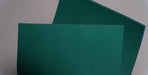 Green diamond surfacing on synthetic elastomer conveyor belt.