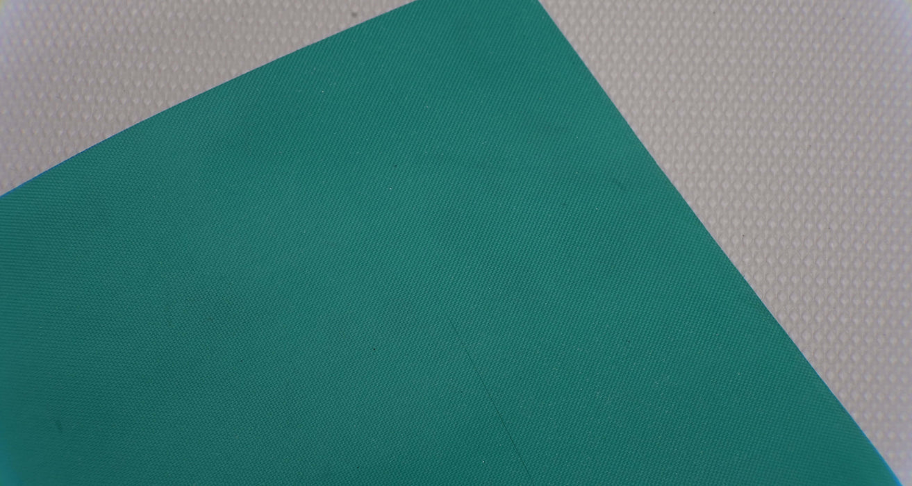 Green top and bottom of synthetic elastomer conveyor belt.