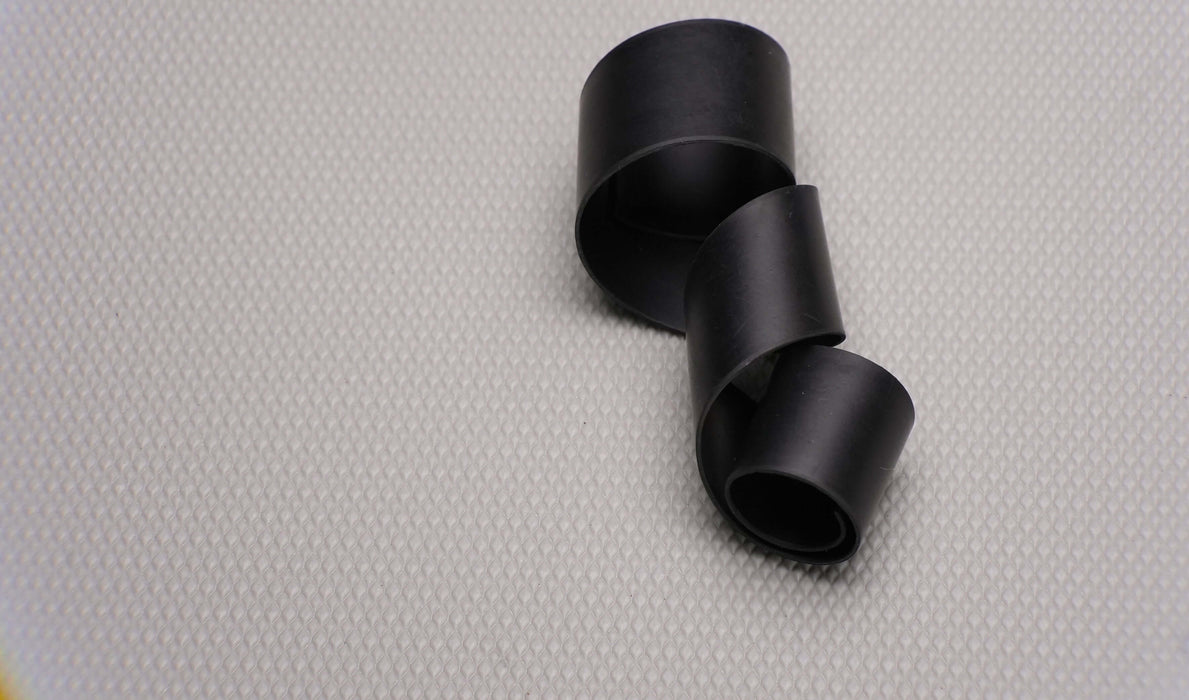 Flexible MOR rubber conveyor belt showing the front and back sides with black smooth surfaces, 1/32" thickness, highlighting both top and bottom materials and flexibility.