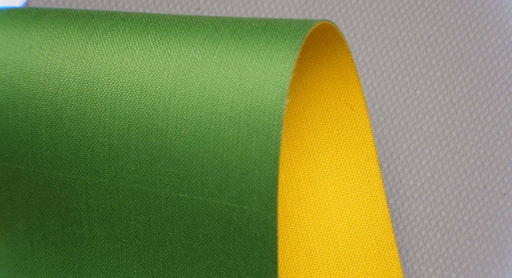 Front and back view of NC nylon conveyor belt, 0.8 nm thickness, yellow top and green bottom, fabric material, 1 layer, 1% elongation at 1.8 N/mm.
