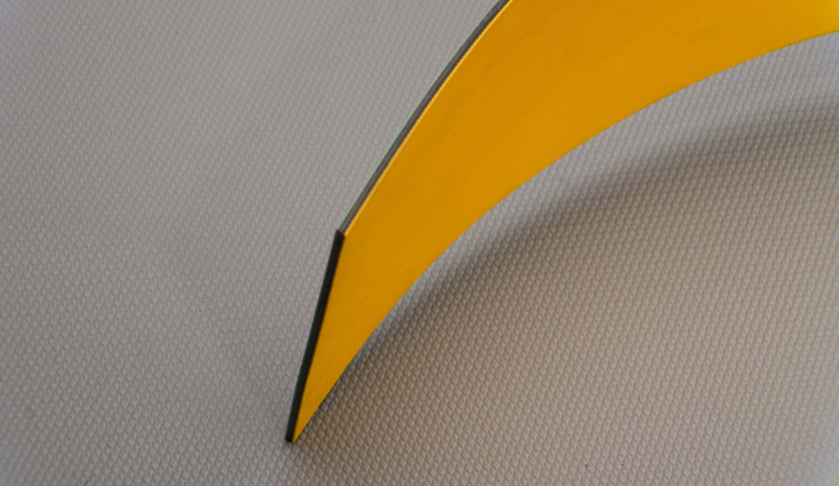 Side view of nylon conveyor belt showcasing its 3mm thickness with yellow and green diamond surfacing.