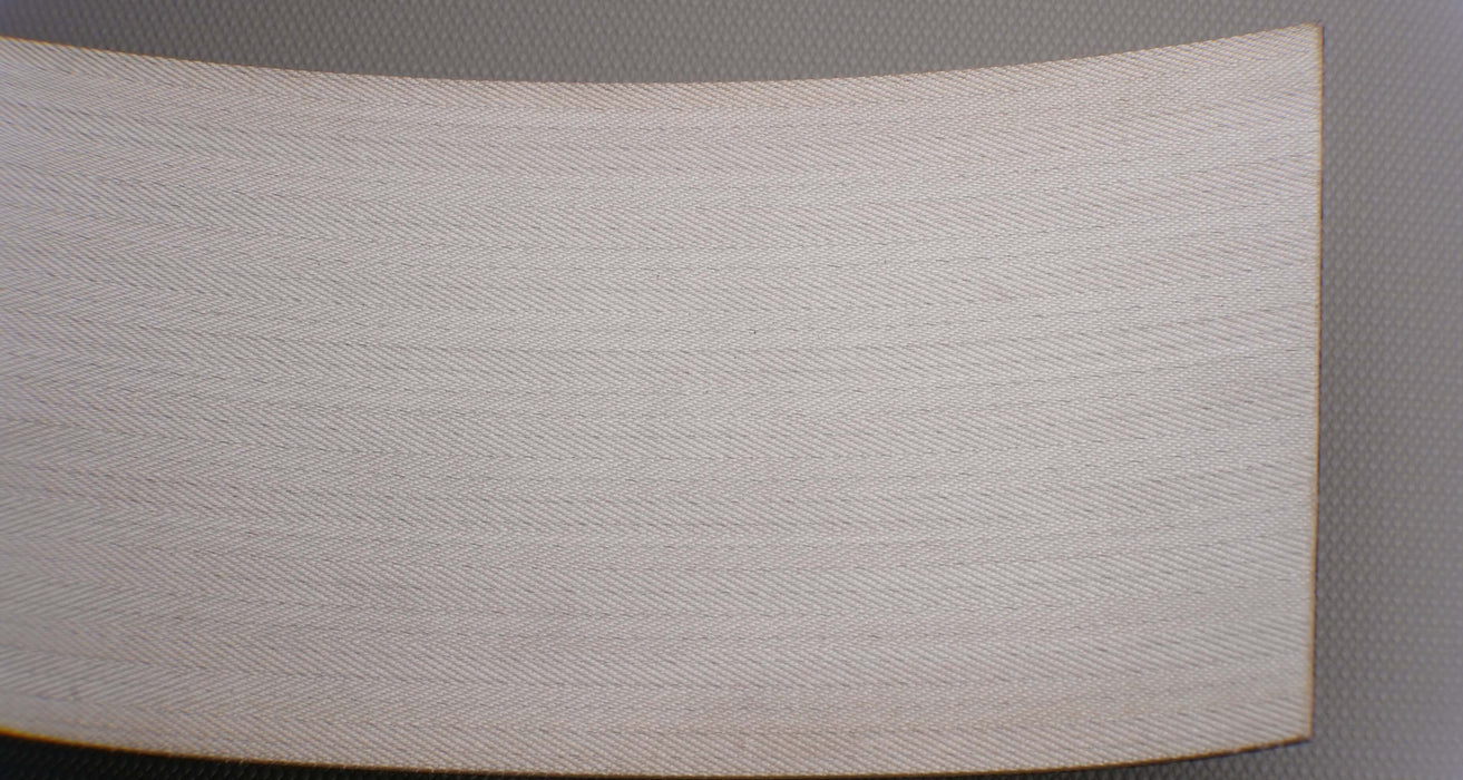 Photo showing the bottom/back side of a PVC conveyor belt with Monofilament fabric. The belt features a black Basket Weave top and a white bottom. Specifications include a thickness of 2mm, strength of 8nm, and dual-layer construction.






