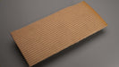 Bottom side view of the rubber conveyor belt showing brown bare RLF fabric with a 7.24mm thickness and pure gum top.