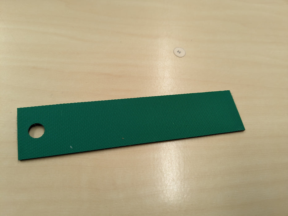 Sample view of NC conveyor belt showing green diamond surfacing top, 1.4mm thickness.
